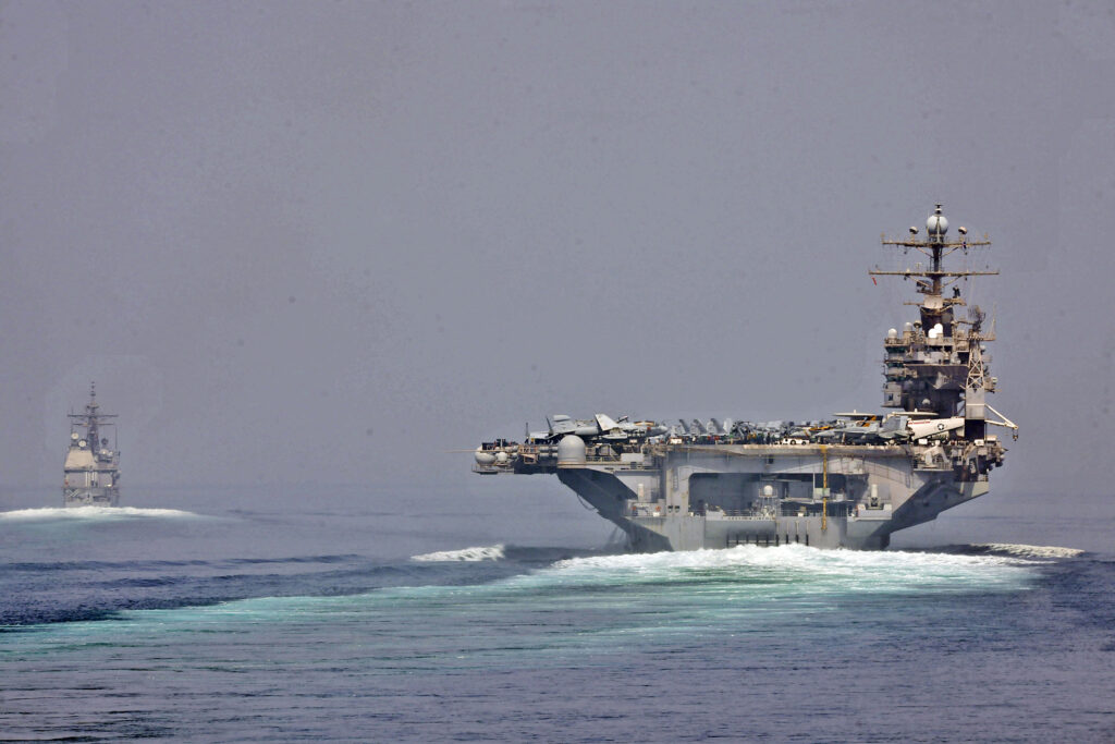 U.S. Navy warships transiting the Strait of Hormuz