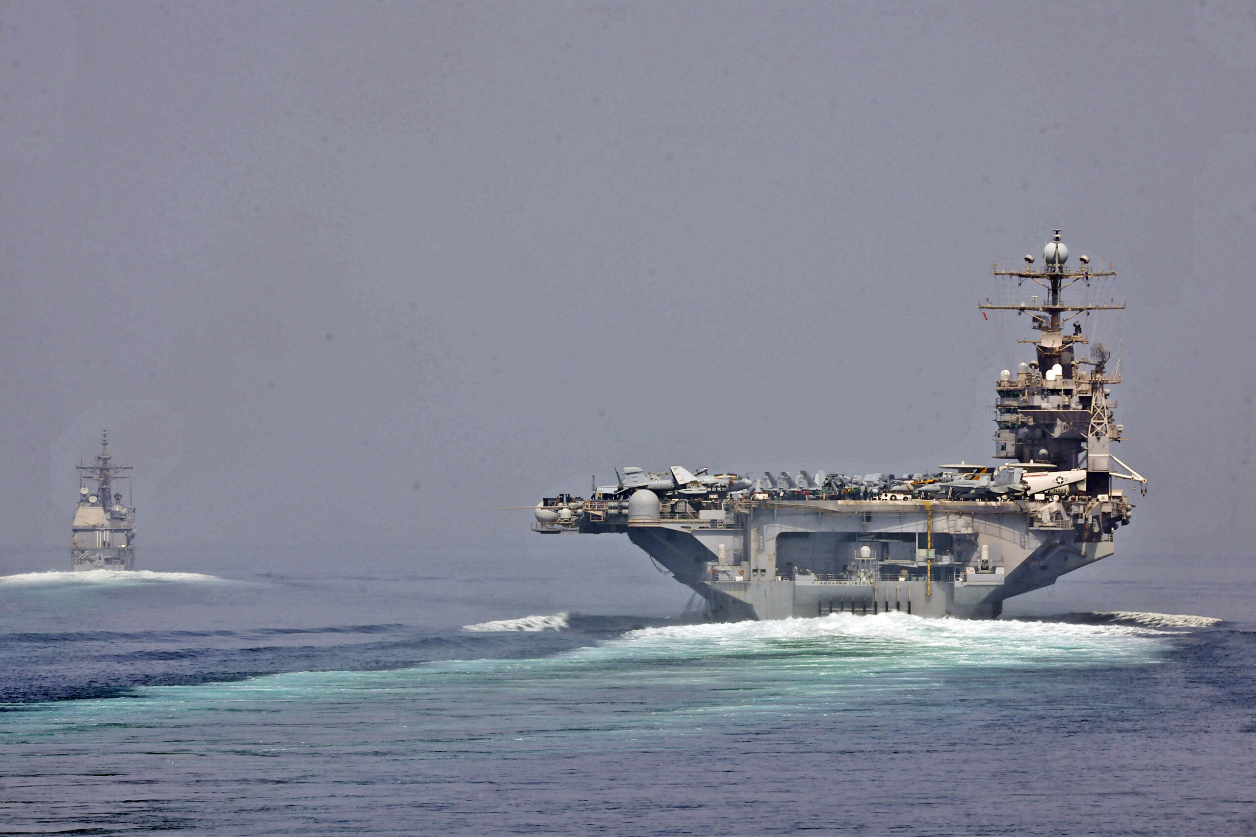 U.S. Navy warships transiting the Strait of Hormuz